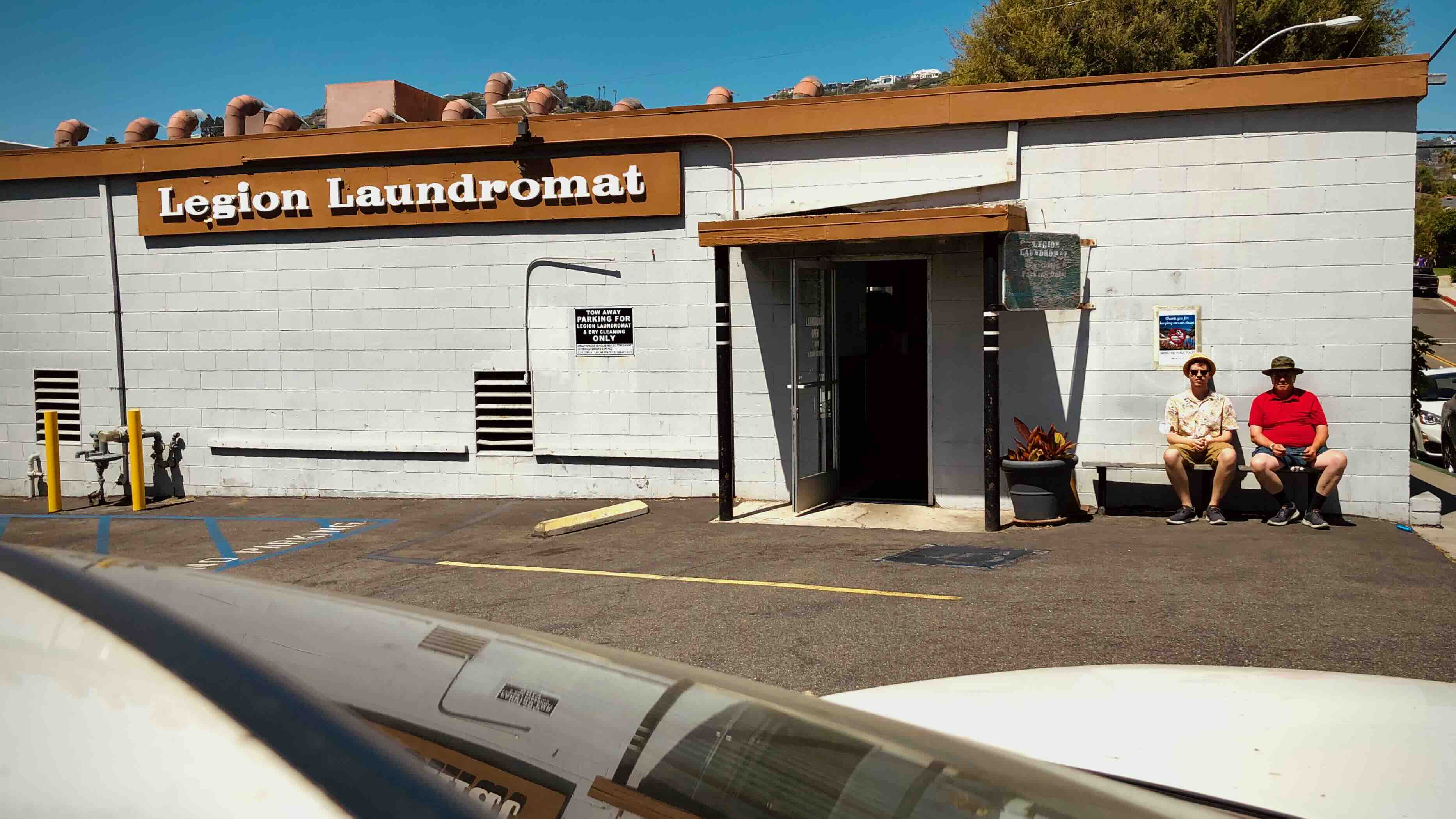 The trustees outside Legion Laundromat